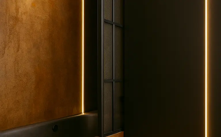 Wnętrze łazienki z brązowymi ścianami i czarnymi detalami w stylu industrialnym.