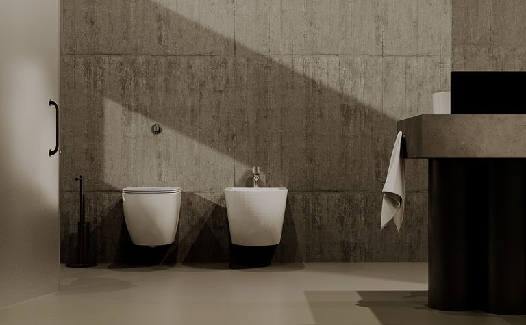 Wnętrze łazienki z betonowymi ścianami i nowoczesnymi elementami w stylu industrialnym.