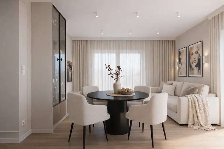 Wnętrze jadalni w stylu quiet luxury i współczesnym z okrągłym stołem i jasnymi krzesłami.