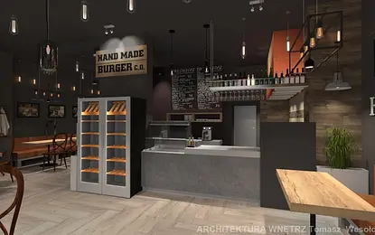 Wnętrze kawiarni z industrialnym stylem, drewniane meble i szare akcenty.