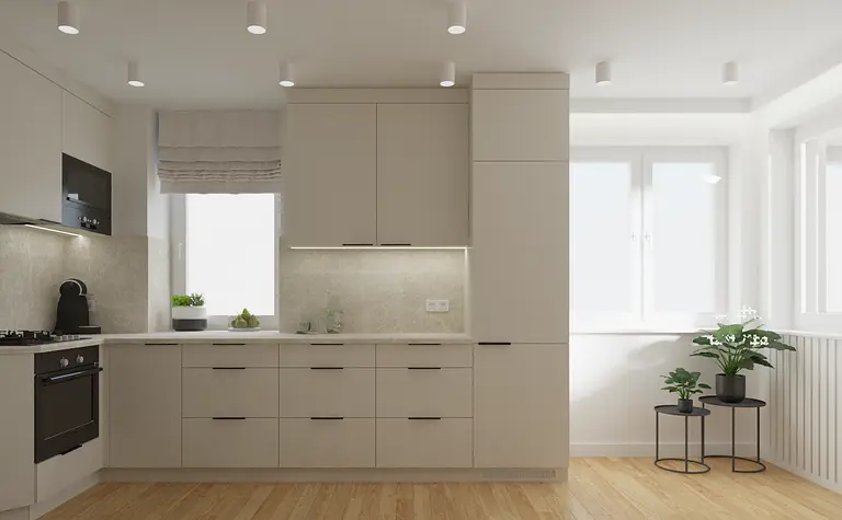 Kuchnia z jasnymi meblami, blatem i roślinami, nowoczesny styl