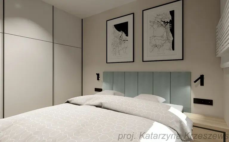 Wnętrze sypialni z niebieskim zagłówkiem, minimalistycznymi meblami i nowoczesnymi grafikami.