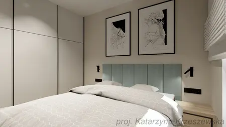 Wnętrze sypialni z niebieskim zagłówkiem, minimalistycznymi meblami i nowoczesnymi grafikami.