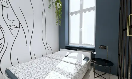 Wnętrze sypialni z białym łóżkiem, niebieską ścianą i roślinnością.