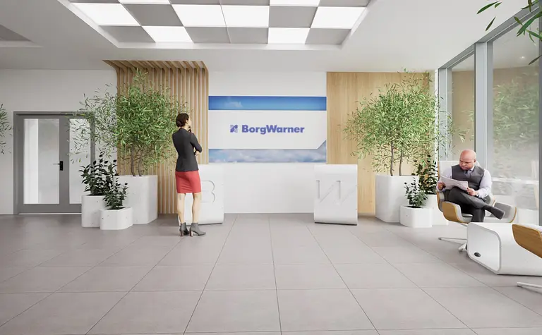 Wnętrze recepcji z industrialnymi elementami, roślinami i nowoczesnym designem.