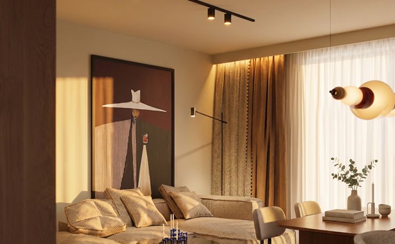 Wnętrze salonu w stylu art deco i eklektycznym z beżowymi meblami.