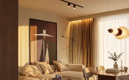 Wnętrze salonu w stylu art deco i eklektycznym z beżowymi meblami.