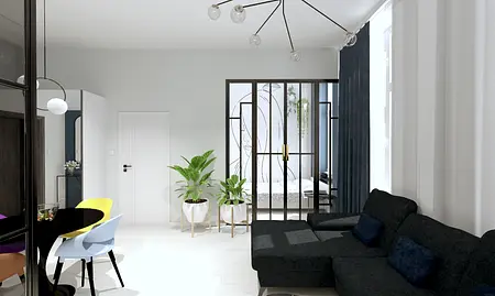 Wnętrze z czarną sofą, kolorowym stołem i roślinami w nowoczesnym stylu.