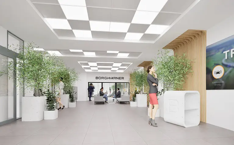 Wnętrze recepcji z roślinami w donicach, nowoczesne meble, industrialny styl.