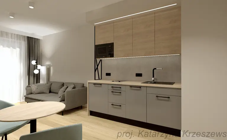 Kuchnia w stylu industrialnym, minimalistycznym i współczesnym z szarymi meblami i drewnianym akcentem.