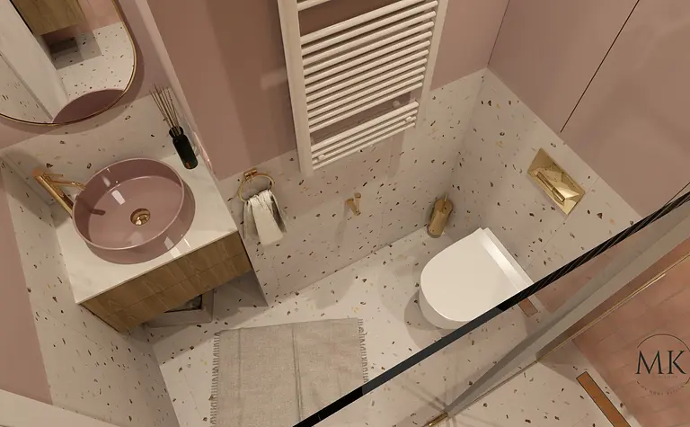 Nowoczesna łazienka z różową umywalką, złotymi detalami i eleganckim wykończeniem.