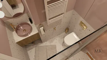 Nowoczesna łazienka z różową umywalką, złotymi detalami i eleganckim wykończeniem.