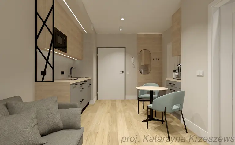 Wnętrze kuchni z minimalistycznym designem, industrialnymi akcentami i współczesnym wykończeniem.