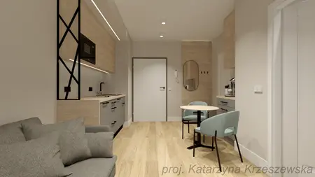 Wnętrze kuchni z minimalistycznym designem, industrialnymi akcentami i współczesnym wykończeniem.