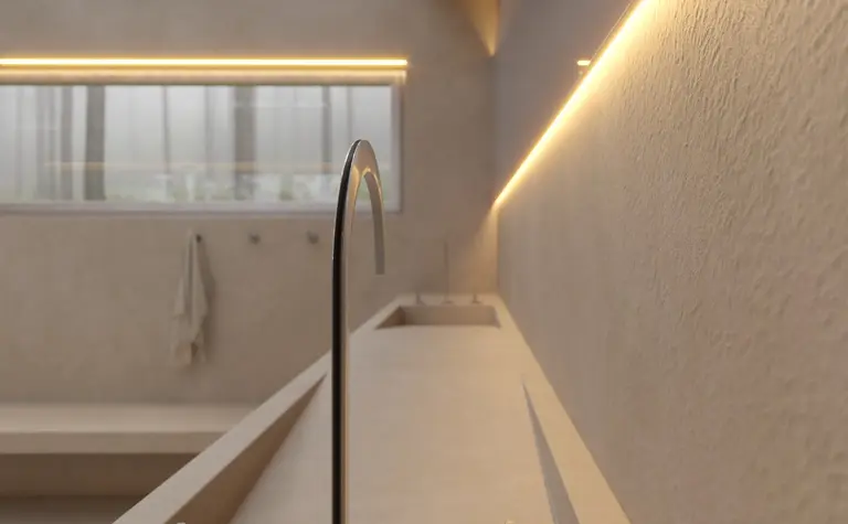 Wnętrze łazienki w stylu soft minimalizm z umywalką i oświetleniem LED.