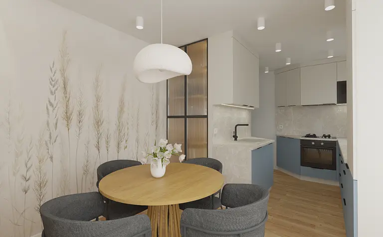 Wnętrze kuchni z okrągłym stołem, szarymi krzesłami i jasnymi akcentami, styl nowoczesny.