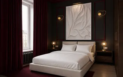 Sypialnia z białym łóżkiem, szarymi ścianami i czerwonymi zasłonami, styl quiet luxury.