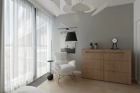 Styl minimalistyczny wnętrza z białym fotelem i drewnianą komodą.