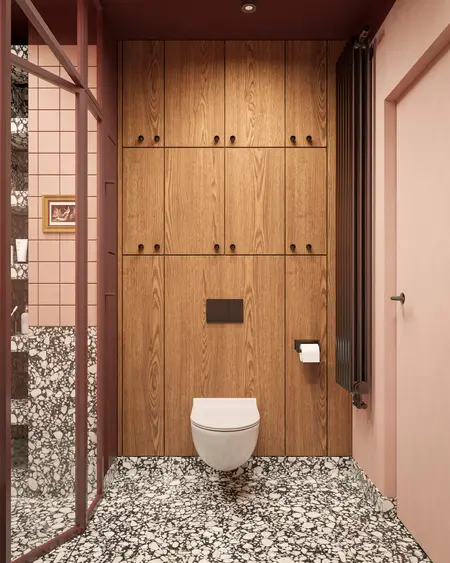 Wnętrze toalety w stylu art deco i vintage z drewnem i różowymi kafelkami.