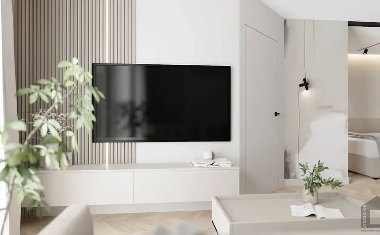 Wnętrze salonu z telewizorem, białymi meblami i zielonymi roślinami, styl glamour i nowoczesny.