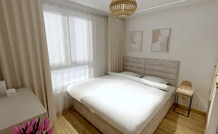 Sypialnia z jasnymi ścianami, drewnianą podłogą i stylowym oświetleniem.