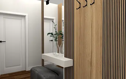 Przedpokój z drewnianymi detalami, lustrem i rośliną w nowoczesnym stylu