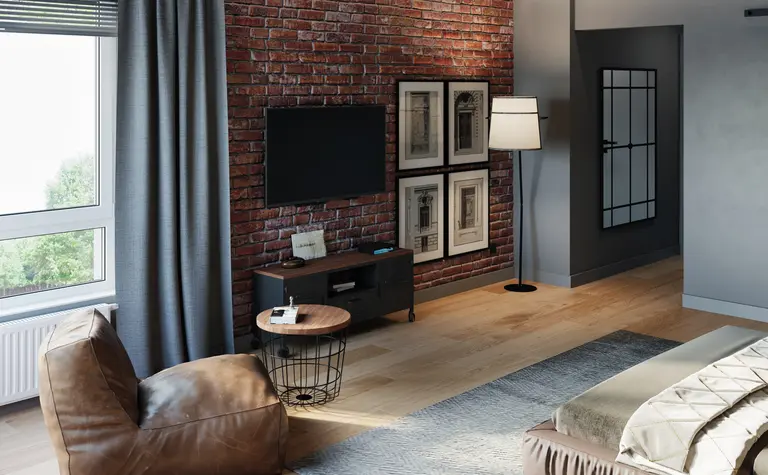 Wnętrze salonu w stylu industrialnym i soft minimalizm z ceglaną ścianą i nowoczesnym oświetleniem.