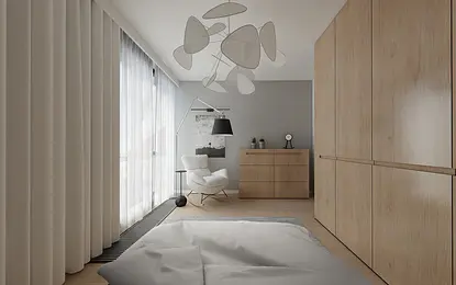 Wnętrze minimalistycznego pokoju z drewnianymi meblami i jasnymi zasłonami.