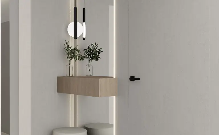 Nowoczesny przedpokój z minimalistycznym oświetleniem i roślinami w szkle.