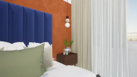 Sypialnia w stylu dopamine decor i skandynawskim z niebieską ścianą i rośliną.