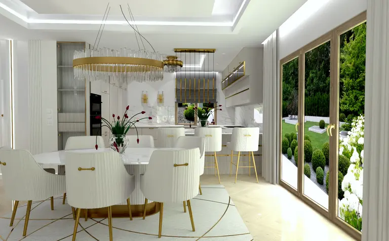 Wnętrze jadalni w stylu glamour z białymi meblami i złotymi detalami.
