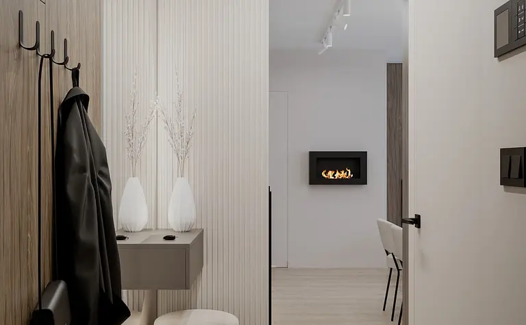 Przedpokój w minimalistycznym stylu z elementami soft minimalizmu i współczesnymi akcentami.