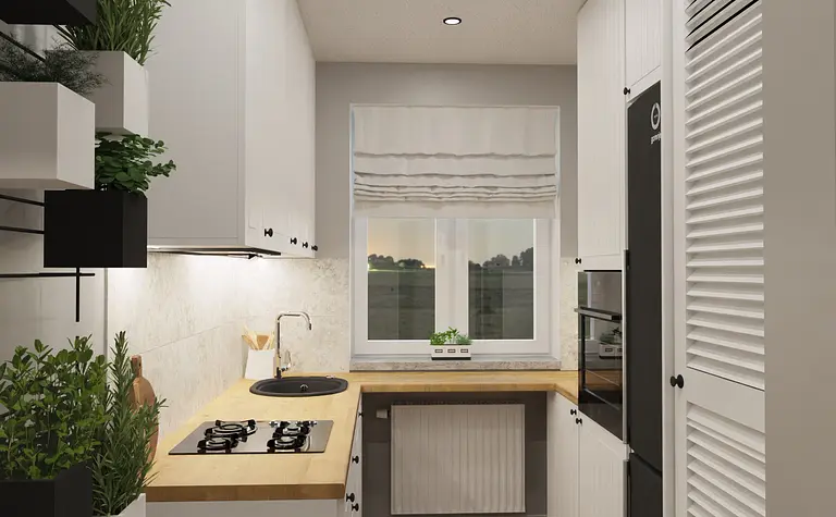 Kuchnia w stylu nowoczesnym i skandynawskim z białymi meblami i drewnianym blatem.