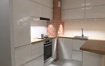 Kuchnia z białymi meblami, ceglaną ścianą i drewnianym blatem. Styl industrialny i nowoczesny.