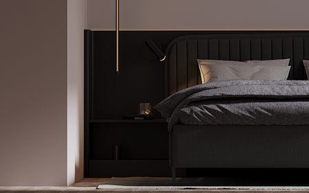 Sypialnia minimalistyczna z ciemnym łóżkiem i szarymi tekstyliami.