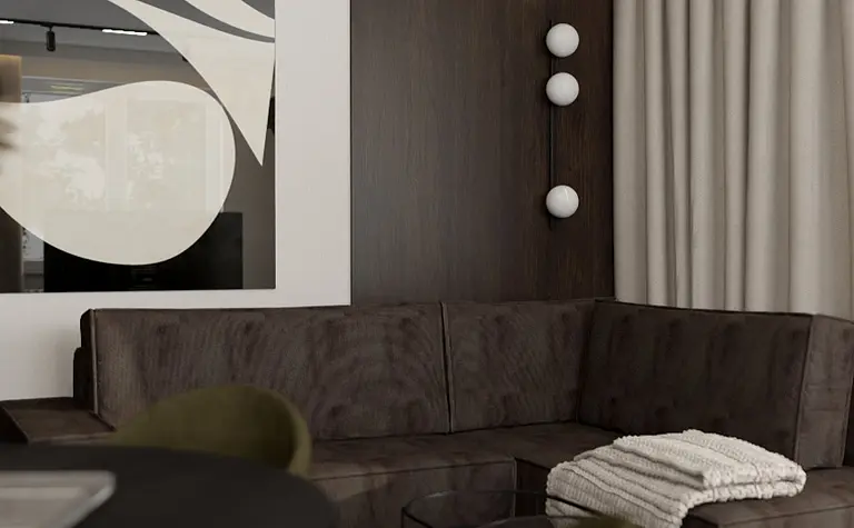 Wnętrze salonu współczesnego z ciemną sofą i dekoracjami quiet luxury.