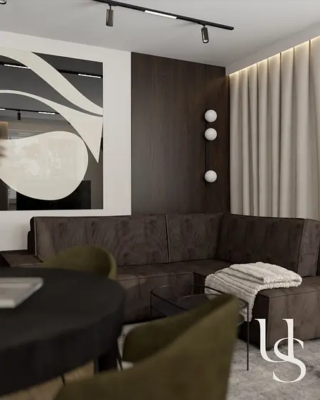 Wnętrze salonu współczesnego z ciemną sofą i dekoracjami quiet luxury.