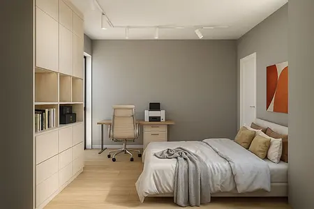Wnętrze współczesnego salonu z minimalistycznym wystrojem, jasnymi meblami i roślinnością.
