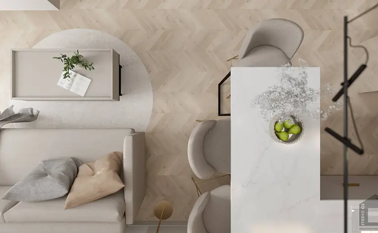 Nowoczesne wnętrze salonu z elementami glamour i industrialnymi, jasne meble i rośliny.