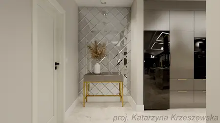 Przedpokój z lustrzanym wykończeniem, minimalistyczny i nowoczesny. Stół z dekoracjami.
