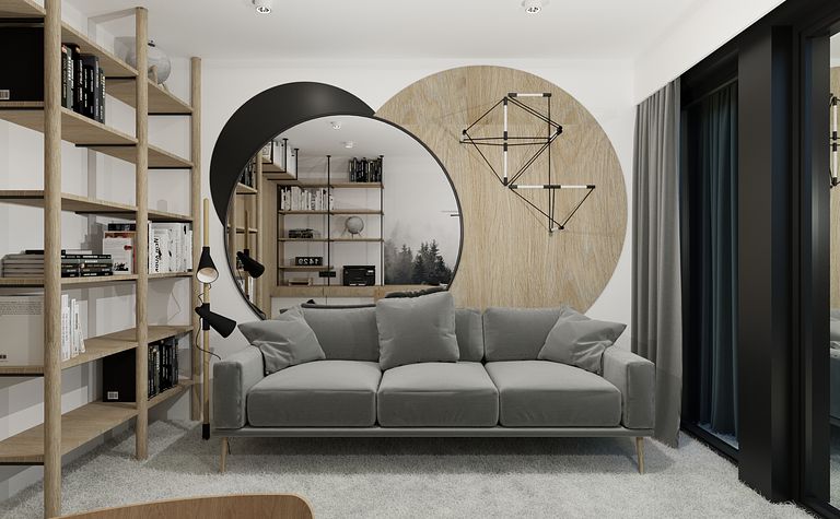 Wnętrze współczesnego salonu z szarym kompletem mebli i drewnianymi akcentami.