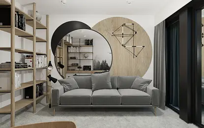 Wnętrze współczesnego salonu z szarym kompletem mebli i drewnianymi akcentami.