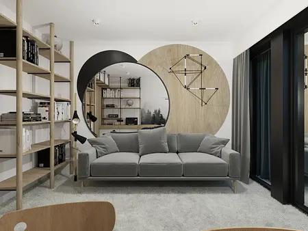 Wnętrze współczesnego salonu z szarym kompletem mebli i drewnianymi akcentami.