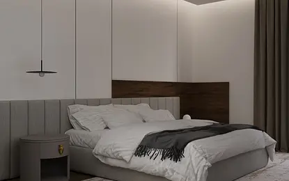 Minimalistyczna sypialnia z szarym łóżkiem i drewnianymi elementami.