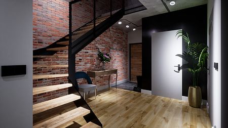 Przedpokój w stylu eklektycznym i industrialnym z ceglaną ścianą i drewnianymi schodami.