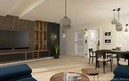 Wnętrze salonu w stylu soft minimalizm z czarnymi akcentami i jasnymi meblami.