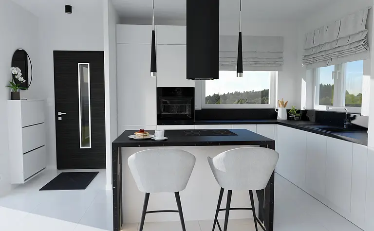Wnętrze kuchni z białymi meblami i czarnym blatem, minimalistyczny i nowoczesny design.