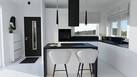 Wnętrze kuchni z białymi meblami i czarnym blatem, minimalistyczny i nowoczesny design.