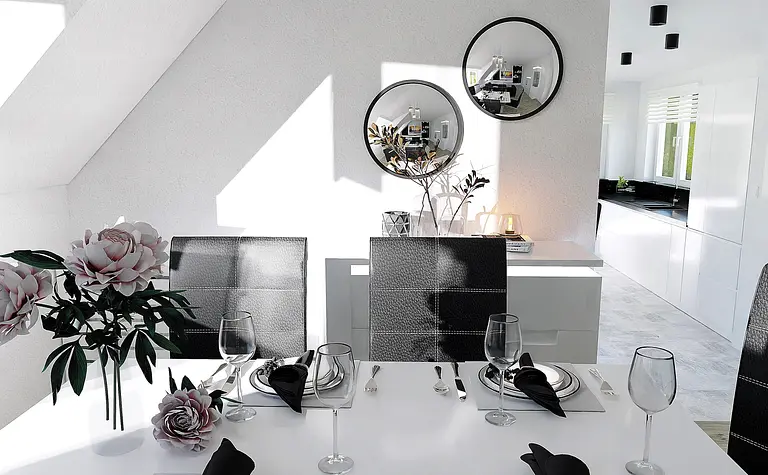 Jadalnia w stylu minimalistycznym z białym stołem, czarnymi krzesłami i kwiatami