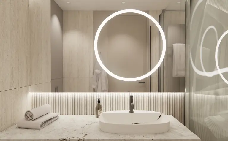 Nowoczesna łazienka z boho i minimalistycznymi elementami, szarymi płytkami i oświetleniem LED.